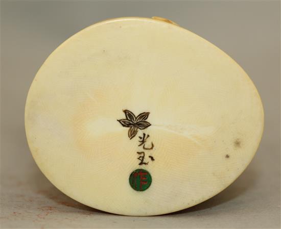 A Japanese ivory group of an immortal and a shi-shi, early 20th century, 18cm